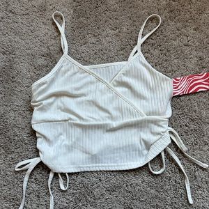 White cross V-neck crop top.